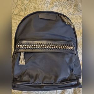 NWTs Backpack in Navy. Two open pockets and a zipper pocket inside. Very Roomy!